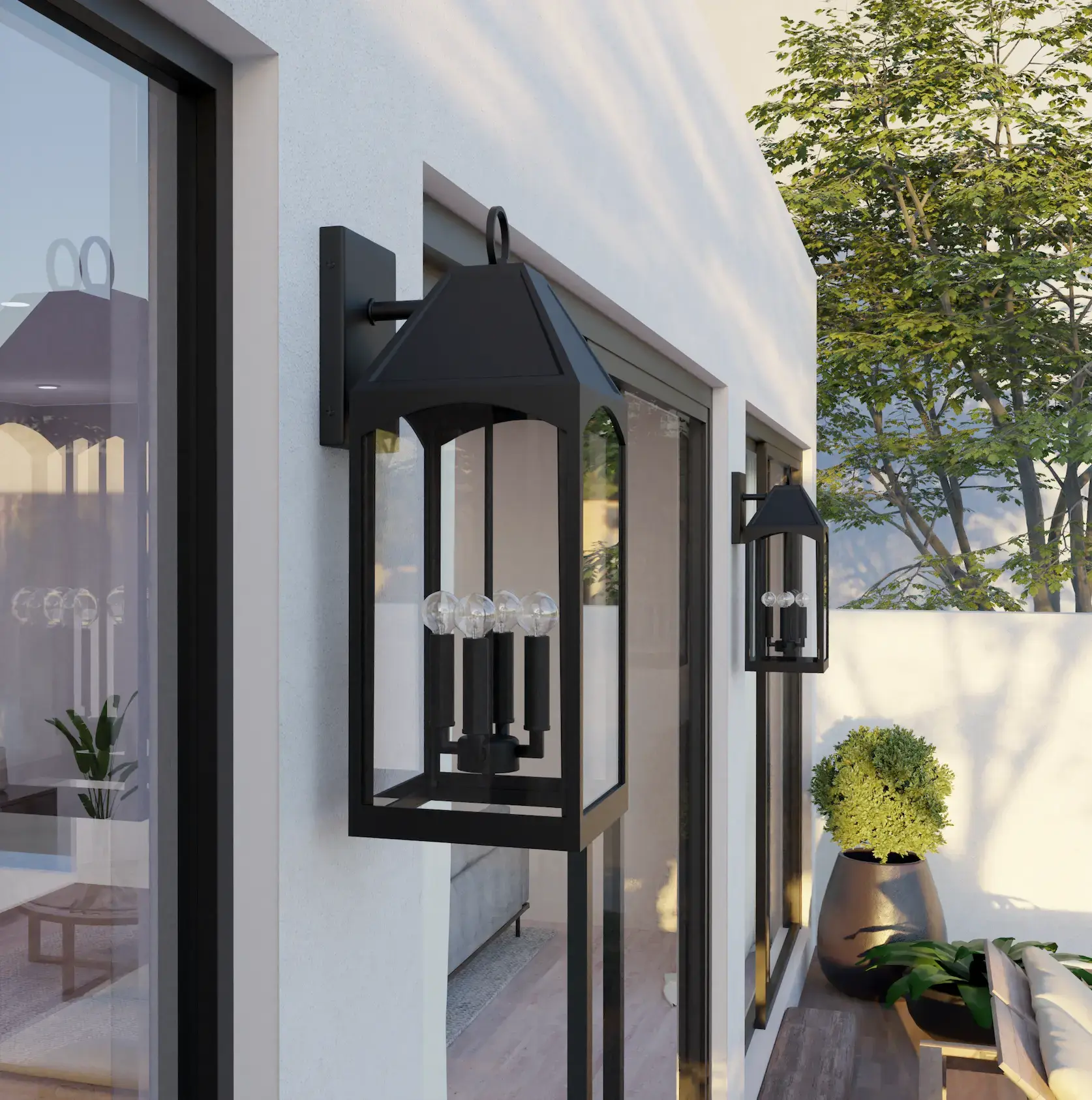 Two tall matte black lantern wall sconces mounted along a white stucco exterior wall